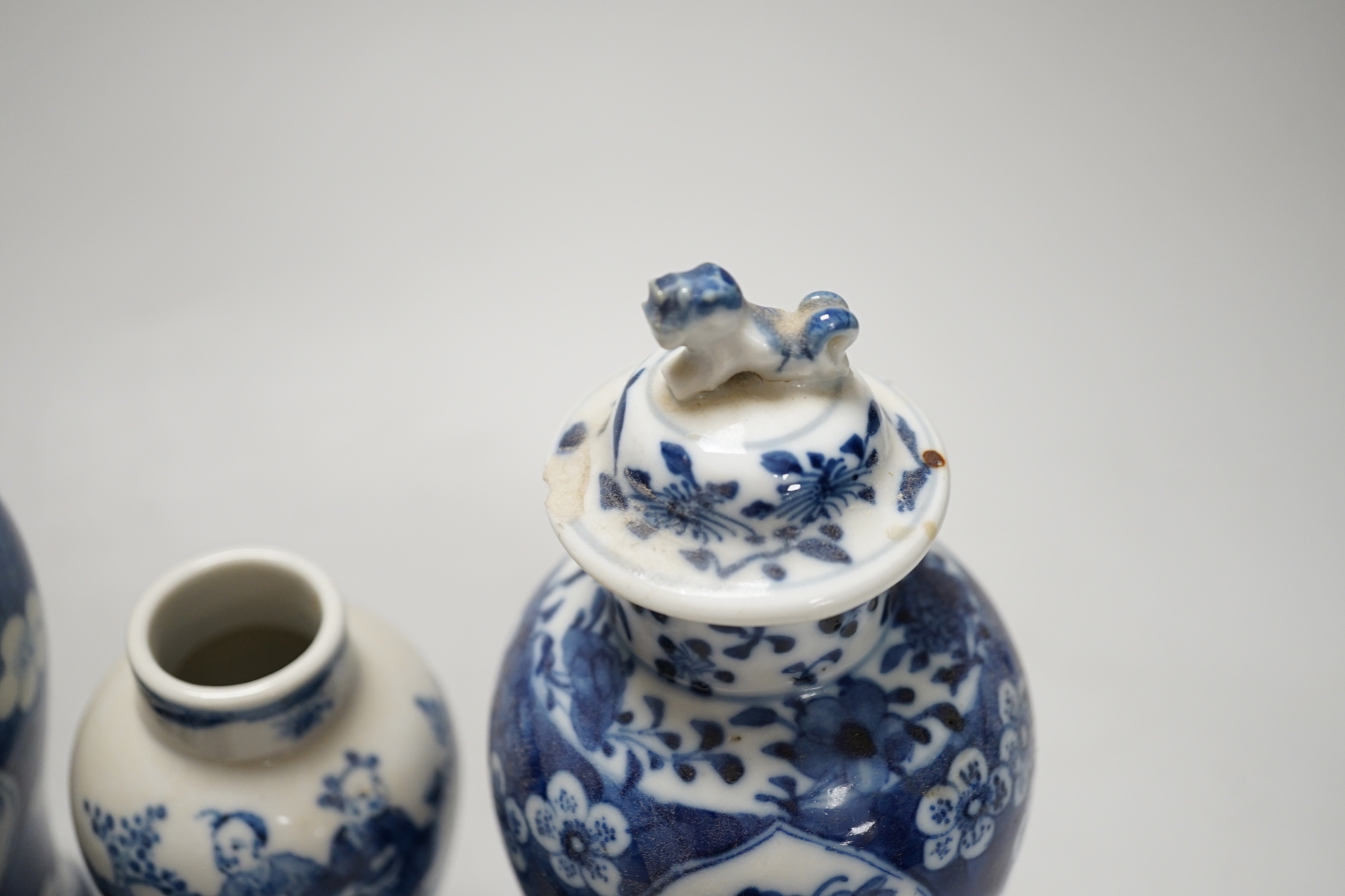 A Chinese armorial blue and white bottle vase, Qianlong/Jiaqing period, and five assorted 19th century Chinese blue and white vases, tallest 20cm; faults